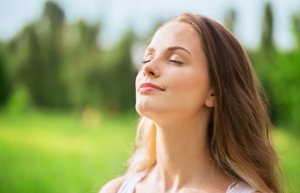 Woman breathing to reduce stress.