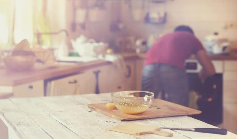 man baking protein cookies in the kitchen