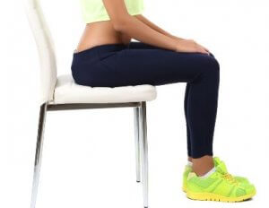 Doing leg lifts while seated