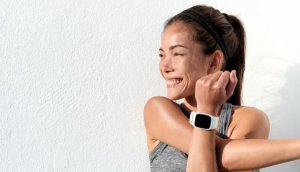 Woman running with one of the best smartwatches.