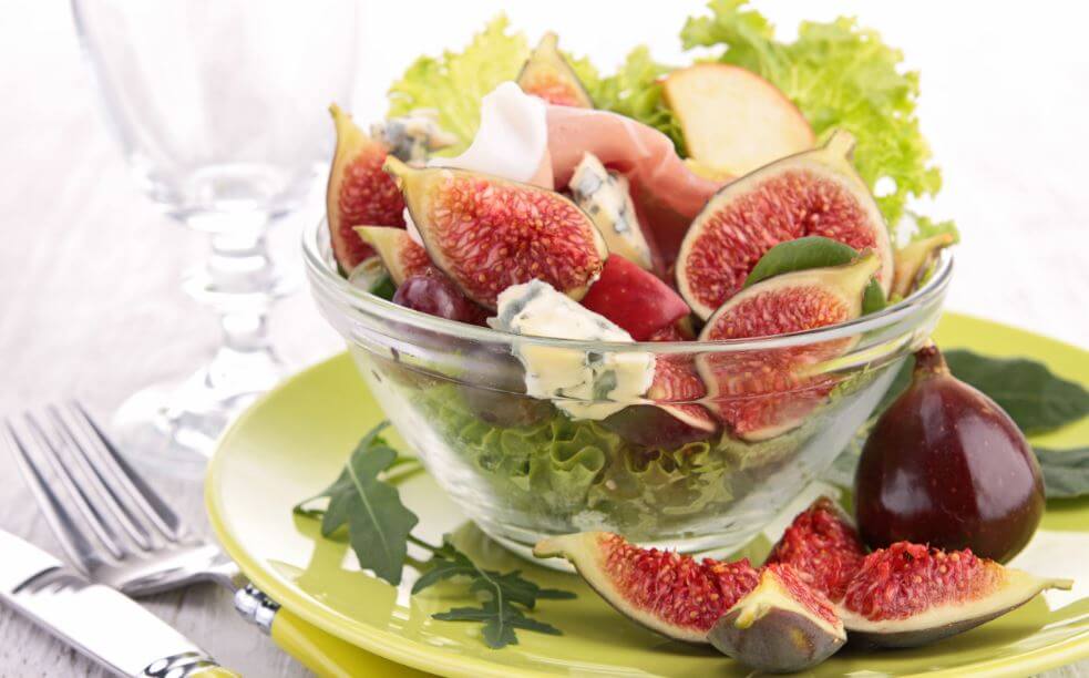 Figs serrano ham and lettuce in clear bowl three salad recipes
