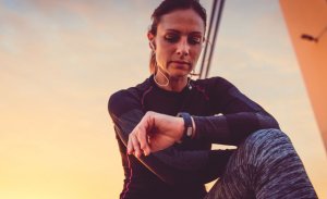 Woman checking fitbit
