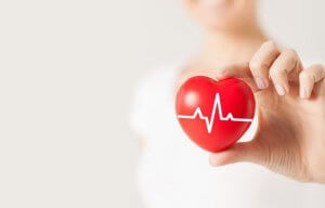 Woman holding heart monitor