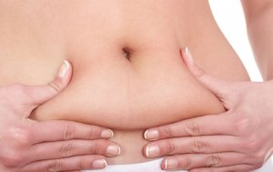 Woman holding stomach