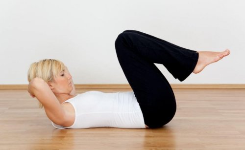 Woman doing situps on floor work out at home