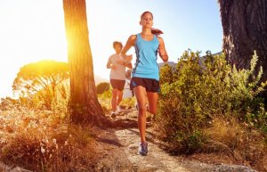 Woman running as aerobic exercise.