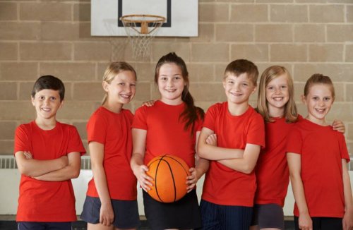 Attention deficit hyperactivity disorder kids playing basketball on a team