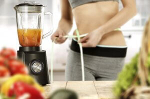 Woman making a post-workout smoothie