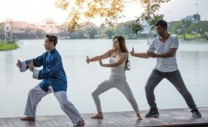 Couple integrating Martial Arts and Yoga.