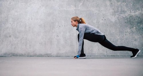 Woman doing leg stretches.