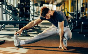 Man stretching at gym