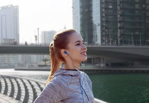 Runner with headphones outdoors