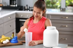 Woman making a protein shake