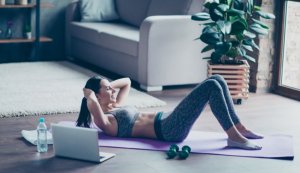 Woman doing traditional crunches in her ab home workout