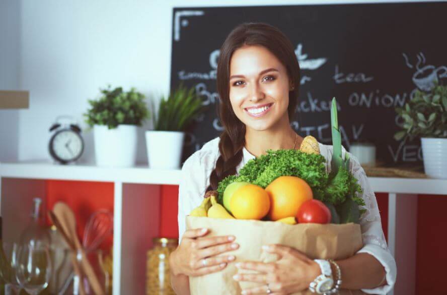 woman with bag of fruit