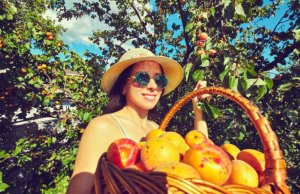 Woman enjoying the benefits of peaches.