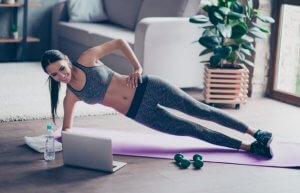 Woman doing lateral planks at home