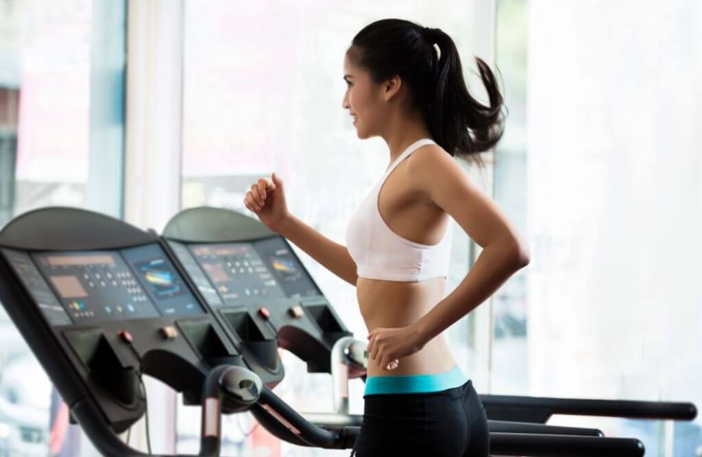 woman running on treadmill
