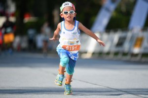 A little kid competing in a race