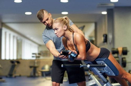 woman and trainer in gym