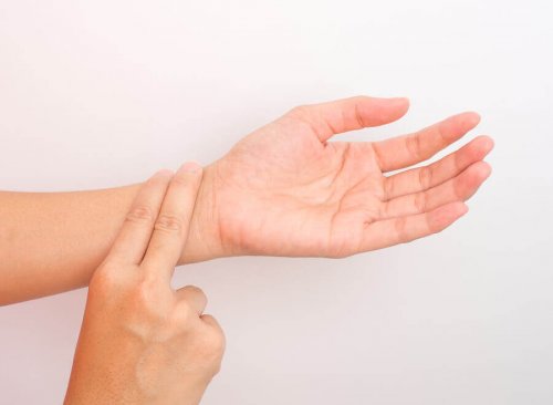 woman's hand taking blood pressure