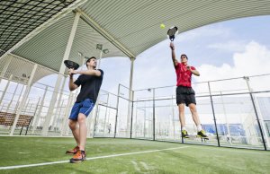 Two men playing paddle tennis