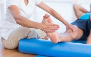 Physiotherapist working with a man.