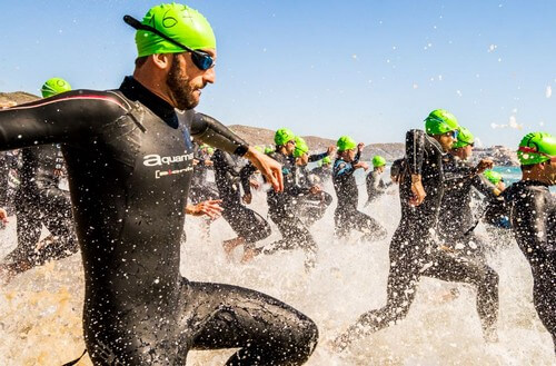 Swimmers entering water