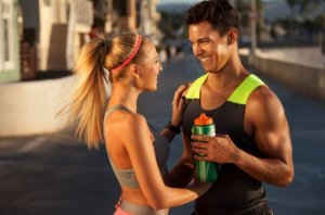 A couple smiling after a workout