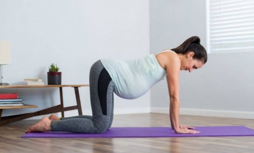 pregnant woman doing yoga