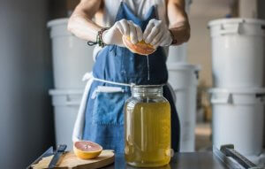 Woman using the food fermentation process to make vinegar