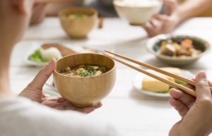 Woman eating miso soup