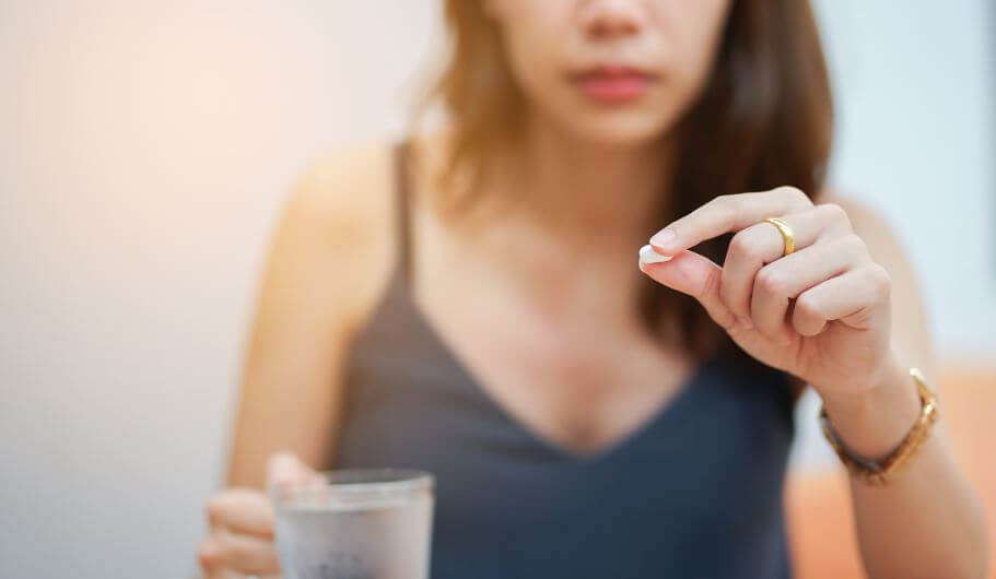 Woman taking supplements