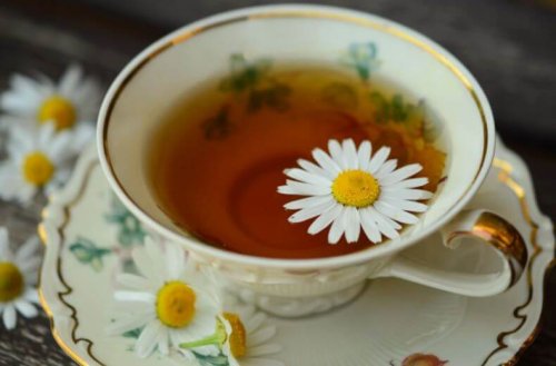 Cup and saucer of chamomile tea