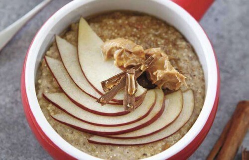 Bowl of porridge with apple slices