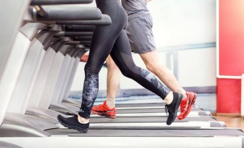 Man and woman's legs on treadmill