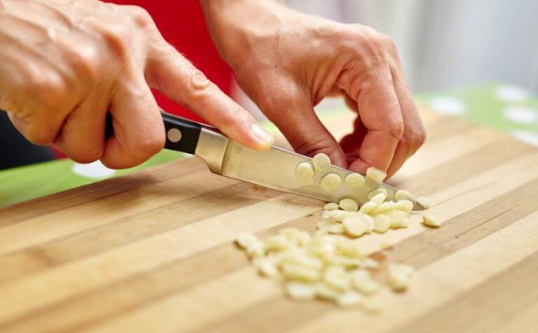 Chopping up garlic to stimulate your immune system