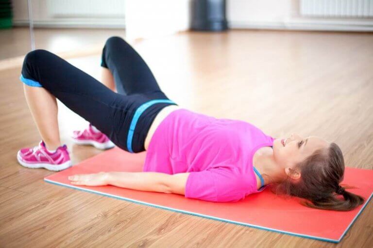 A woman doing kegel exercises to strengthen her pelvic floor