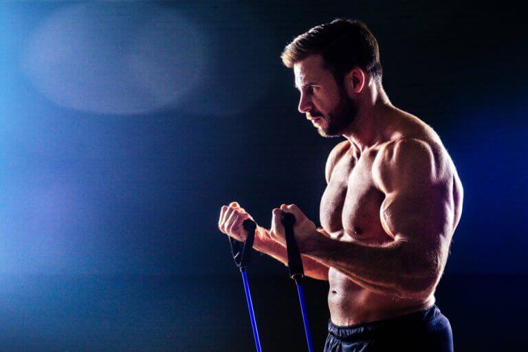 A man performing arm exercises with a resistance band