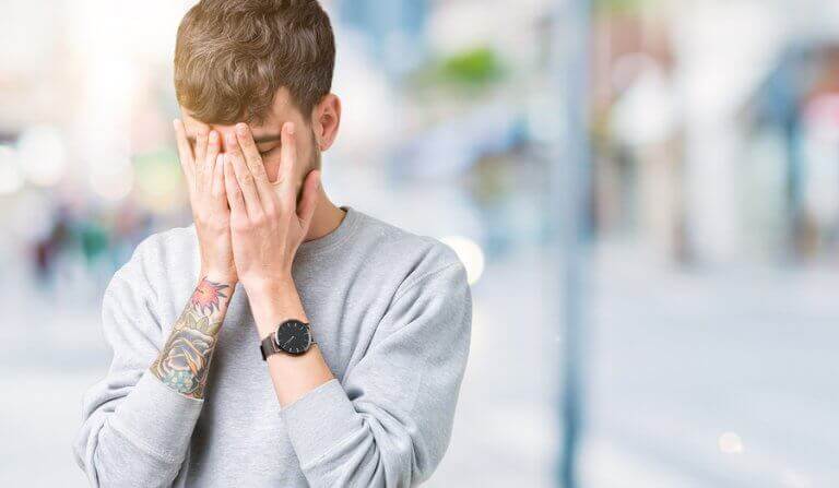 A sad man regretting having poor emotional magement