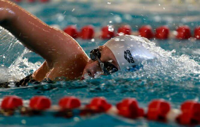 A swimmer in an olympic pool to exemplify a water sport option