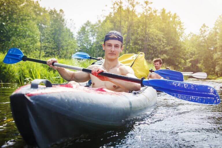 Two men rowing in a lake for fun