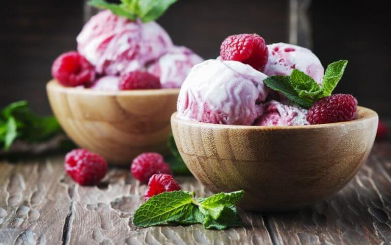 Two bowls of raspberry and yogurt ice cream to go with the recipe.
