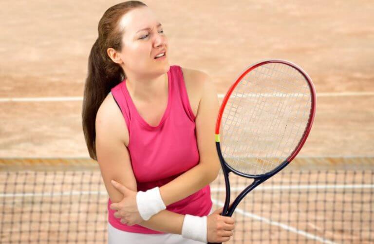 A tennis player with some type of sport injury in her elbow