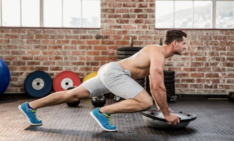 A man doing exercises with a bosu to get fit for ski