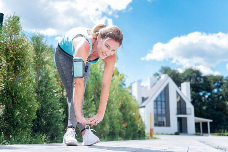 A woman stretching outside