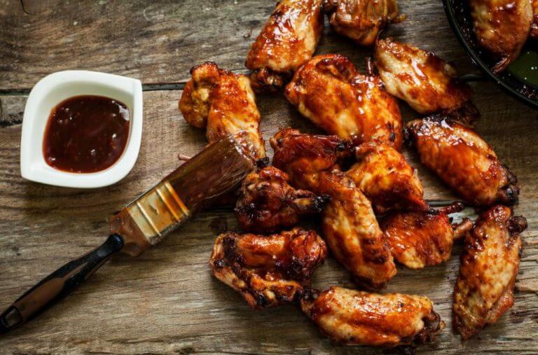 Chicken wings in barbeque sauce to show that method of cooking