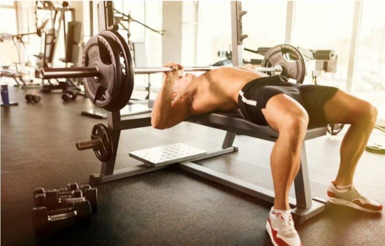 A man doing chest press exercises to work on his muscles