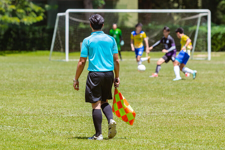 A soccer referee must pass theoretical and practical exams before he can practice.