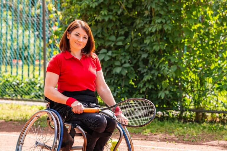 A woman playing racket sports for disabled people